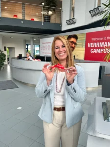 woman smiling holding a plastic dolphin welded by ultrasonic welding